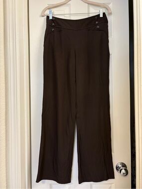 Vintage brown flare leg dress pants with button detail at hip